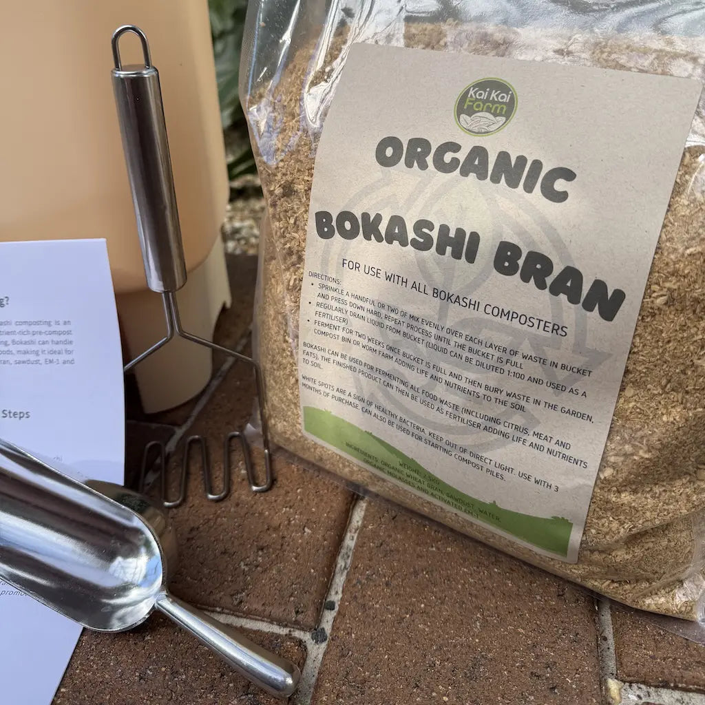 Bag of organic bokashi bran with a label on a tiled surface.