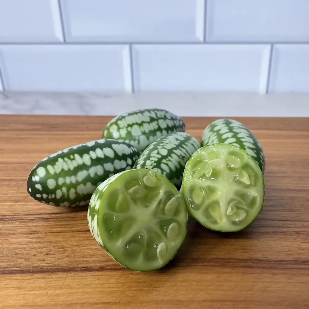 Close Up On Cucamelons (Mouse Melons) Cut Up Showing Juicy Crunchy Seeds