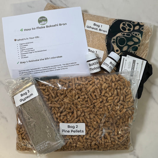 Bokashi bran kit with labeled bags and instructions on a marble surface