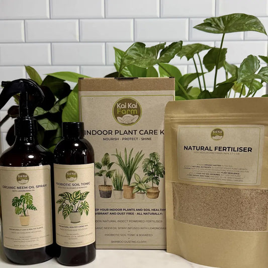Indoor Plant Care Kit including organic neem oil spray and probiotic soil tonic for healthy indoor plants.