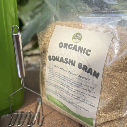 Bag of organic bokashi bran with a compost masher tool