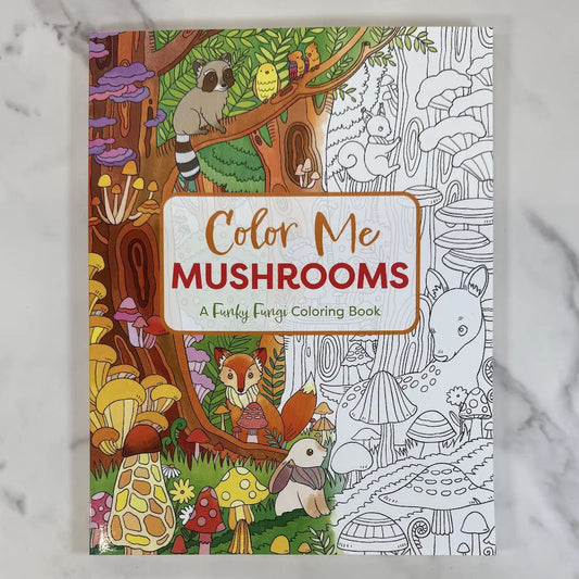 Coloring book titled 'Color Me Mushrooms: A Funky Fungi Coloring Book' with forest-themed illustrations on a marble surface.