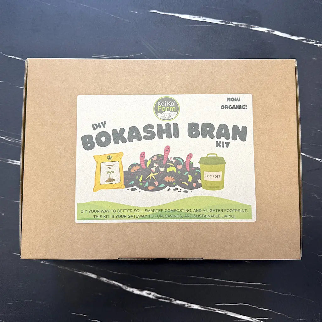 Kai Kai Farm DIY Organic Bokashi Bran Kit packaging on a marble surface with tiled wall background