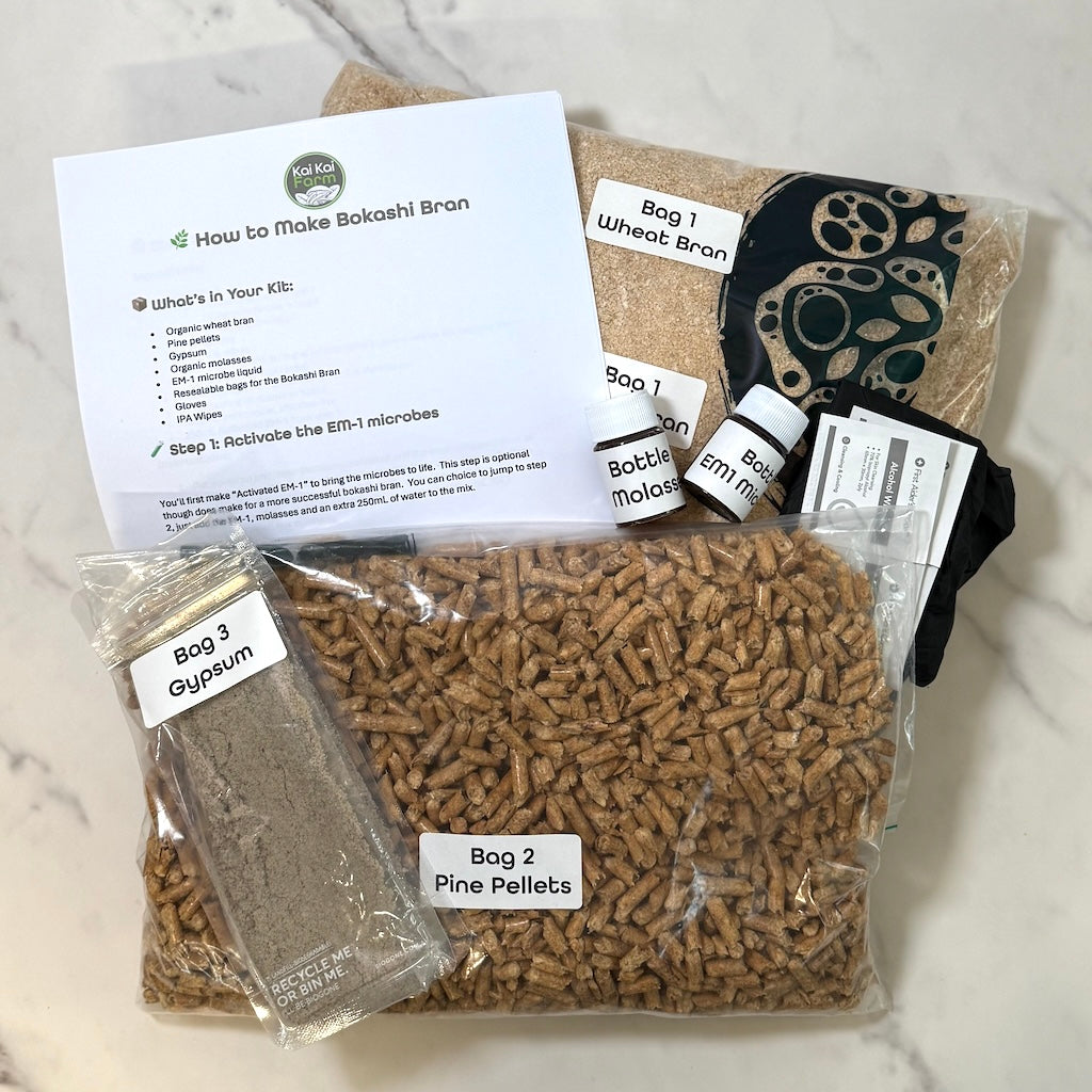 Bokashi bran kit with packaging and instructions on a marble surface