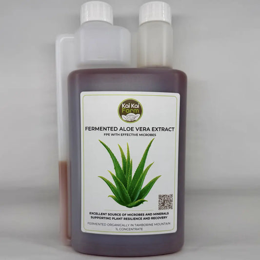 A 1-liter plastic bottle of Kai Kai Garden Fermented Aloe Vera Extract PPE with effective microbes, featuring a white label with an aloe vera illustration, set against a plain light gray background.