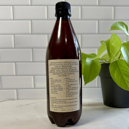 Bottle of Grow & Glow showing the back label instructions - Natural, Just Activated EM-1, Molasses, and Purefied Rain Water