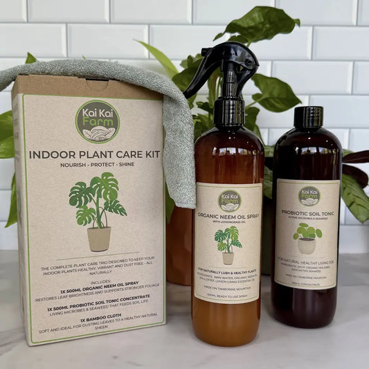 Indoor Plant Care Kit including organic neem oil spray and probiotic soil tonic for healthy indoor plants.