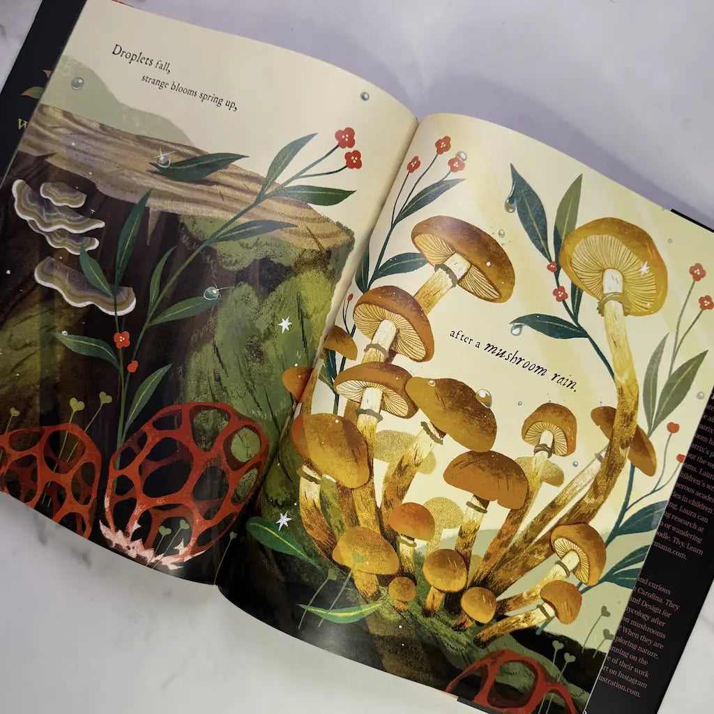Open book with illustrations of mushrooms and foliage on a white background