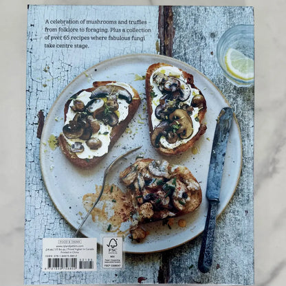Book cover with mushroom toast on a plate, rustic background